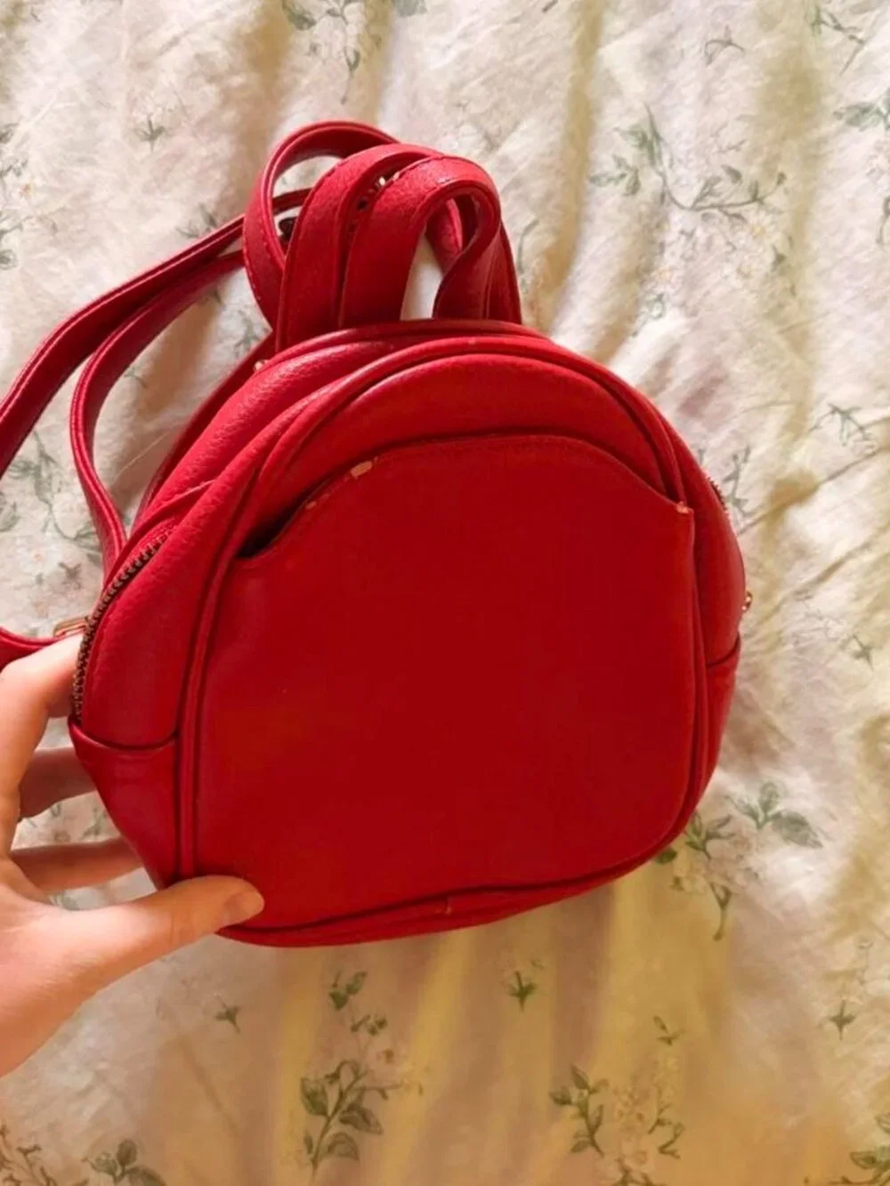 Red mini backpack with gold hardware